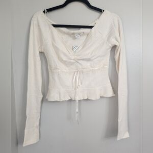 Women’s Cream Ribbed V-Neck Long Sleeve Top with Ruffle Hem